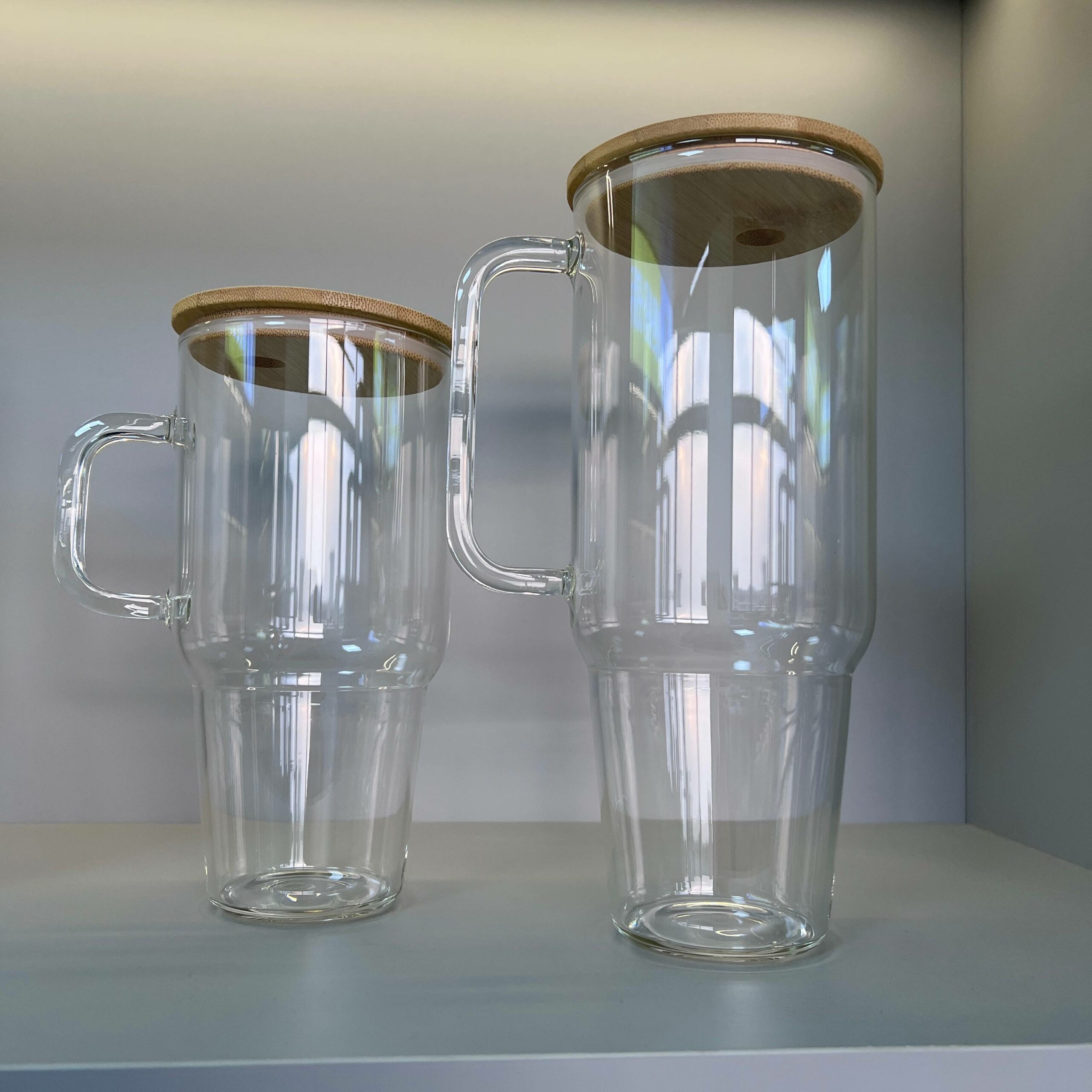 https://gobesin.com/wp-content/uploads/2023/09/sublimation-glass-tumbler-with-handle-bamboo-lid-1-scaled.jpg